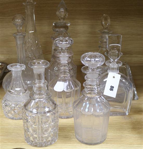 A collection of cut glass decanters
